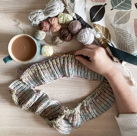 Emma sits at her kitchen table one morning working on the bits and bobs blanket with a cup of tea. 