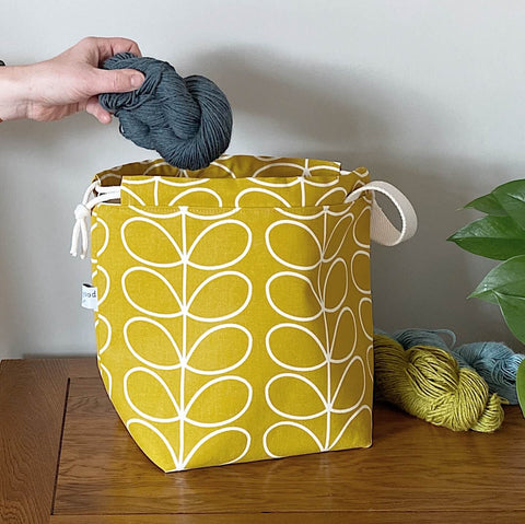 A knitting project bag from the Orla Mustard range, handmade by Eldenwood Craft