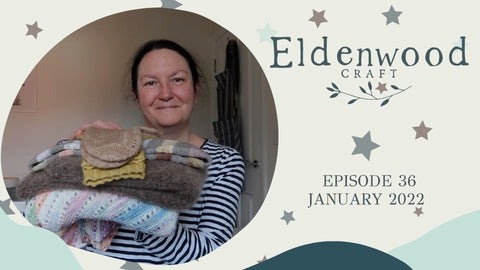 Emma holds a large pile of finished knitted objects and next to here is text that tells the reader this is episode 36 of the Eldenwood Craft podcast and that it is January 2022
