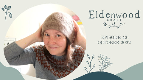 Eldenwood Craft Knitting Podcast front screen showing the host, Emma, proudly wearing a new knitted hat. 