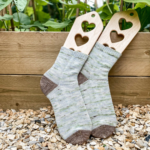 Hand knit socks in Eldenwood Craft's vegetable patch