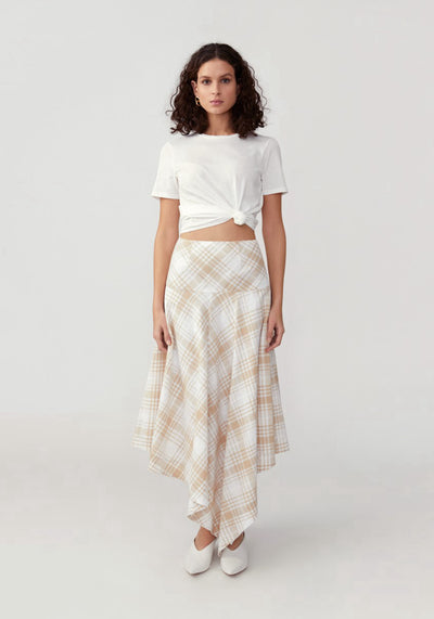 Woman in tan checkered skirt front.