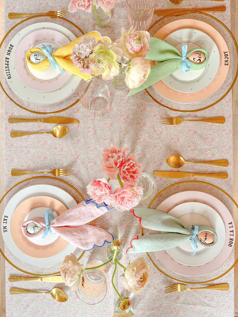 easter table decor with bunny napkins and spring flowers