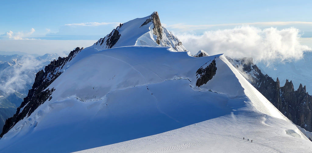 Climbers traversing from the Col de la Branva to the Col du Mont Maudit (descending) on the Trois Monts Route of Mont Blanc.  Photo: Zeb Blais.