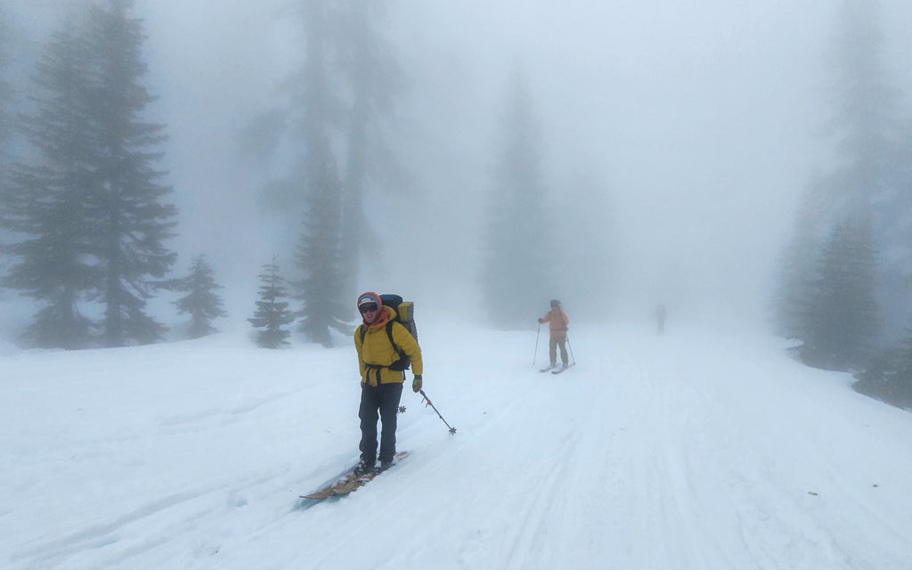 guides backcountry skiing out to the bunny flat trailhead during a storm on Mt Shasta