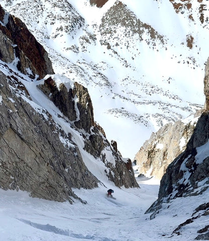 Snowboarder in the backcountry Mt. Emerson couloir Eastern Sierra backcountry