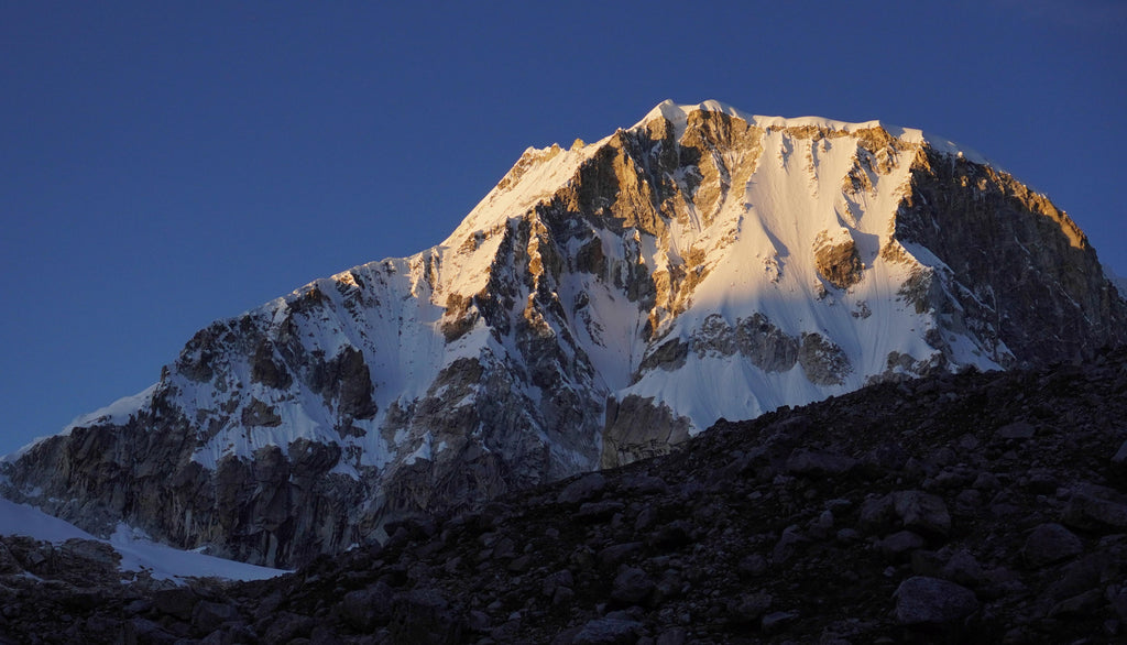 Early morning light adding color and definition to Ranrapalca during the Ishinca Traverse. Photo: Zeb Blais