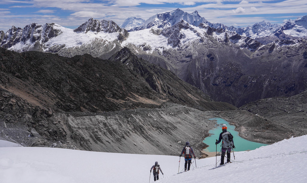 Descending with Nevado Urus, Urus Este and Ishinca Lake . Photo: Zeb Blais.