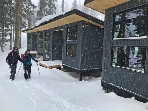 Backcountry skiers in front of the Frog Lake Huts