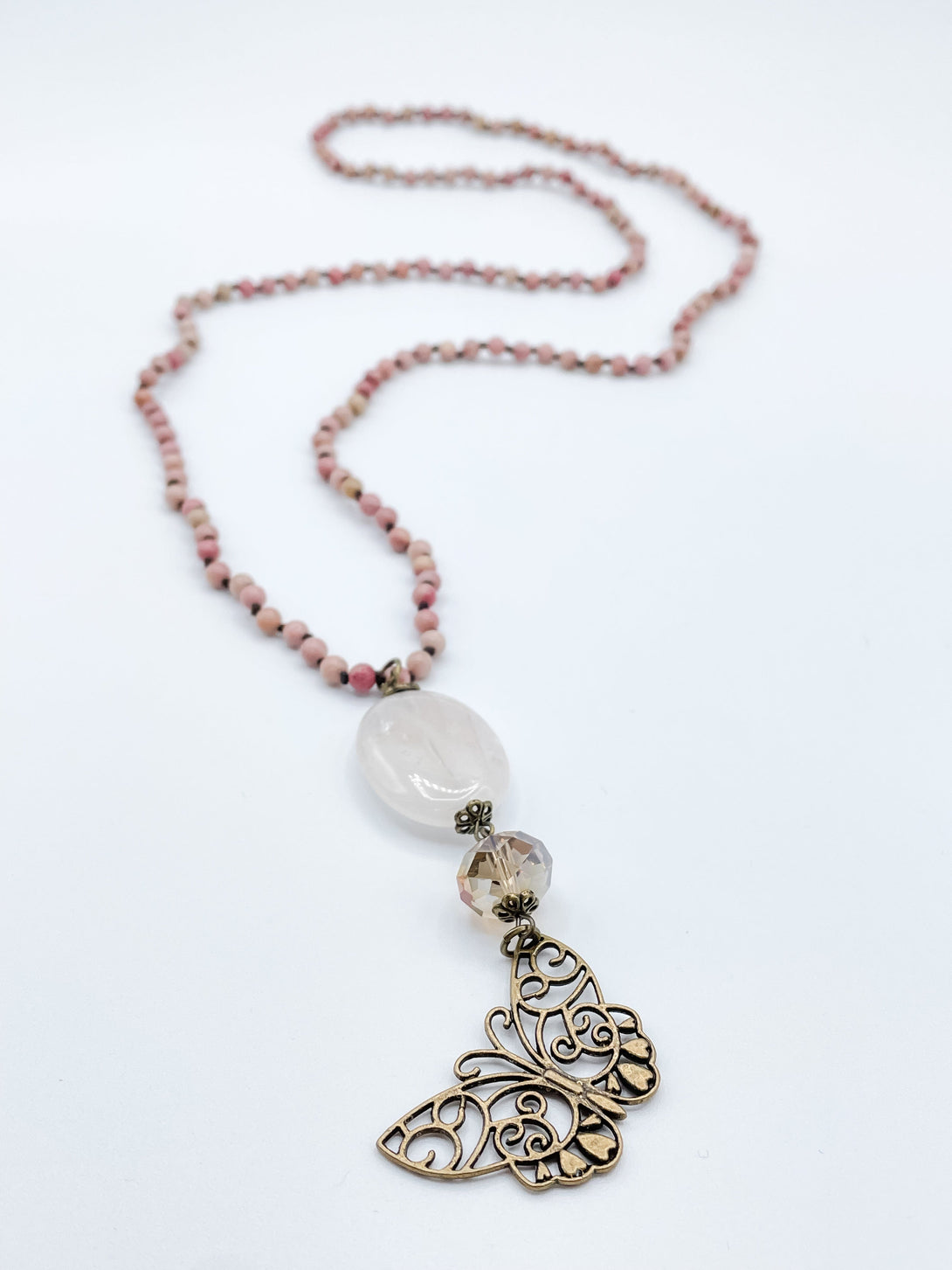 Long Beaded Necklace with Large Oval Stone, Faceted Crystal, and Butterfly Pendant