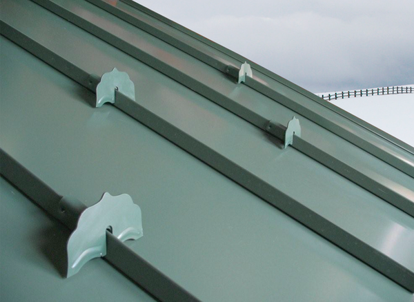 will snow guards for metal roofs help with rain flow