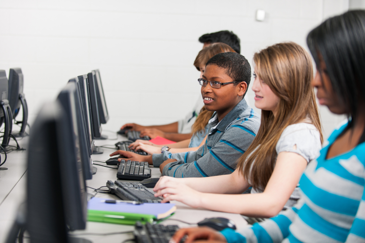 Junior High students on a computer in a classroom