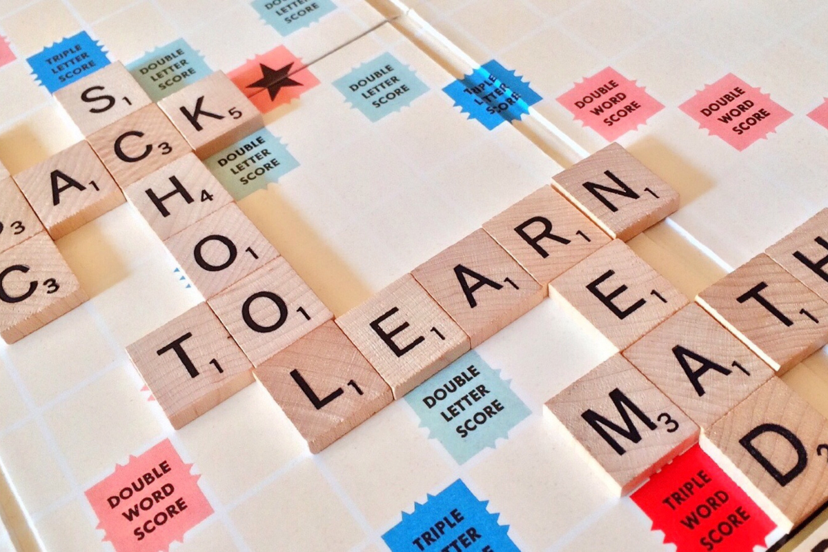 Scrabble Board Game with education words on it, Ex. School, math, learn, read