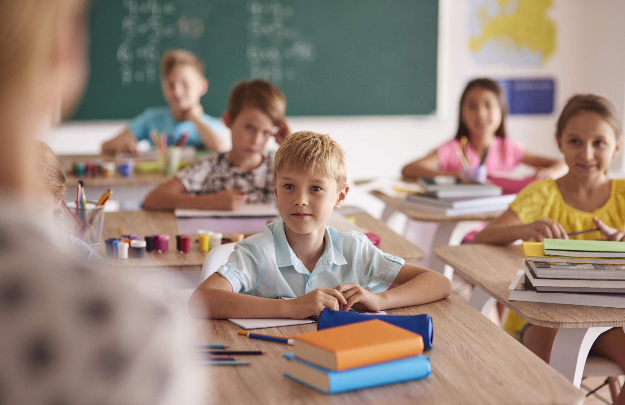 Children Sitting at desks in a classroom