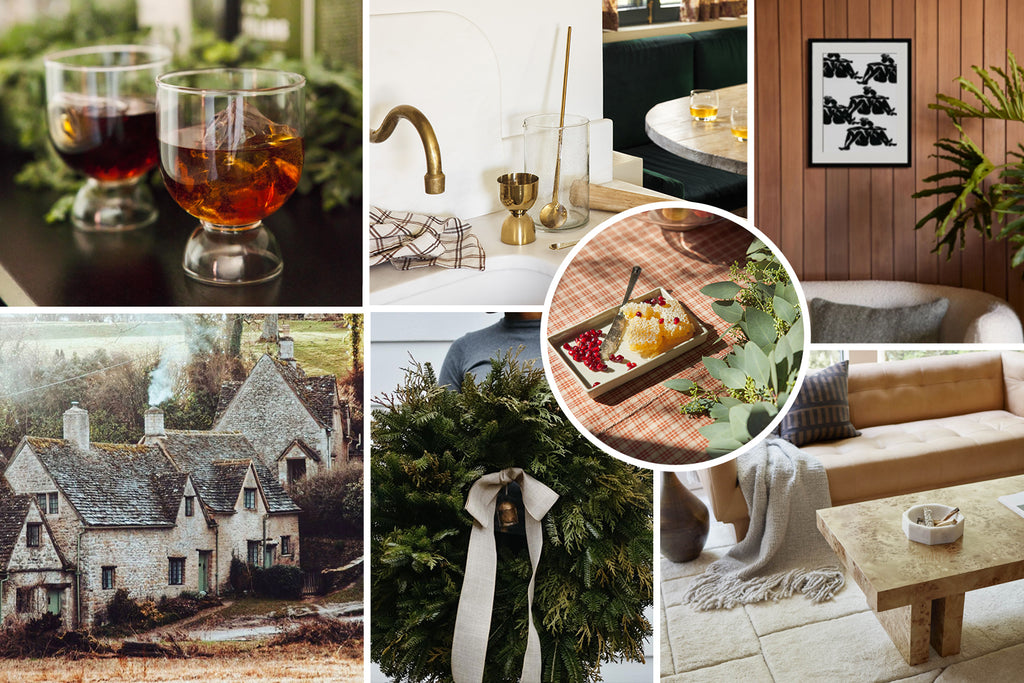 An image collage with two rounded lowball glasses with whisky over ice; a sink with a gold faucet and a gold jigger and cocktail stirrer sitting next to it; a dessert with pomegranate seeds sitting on a square tray; a black abstract drawing of repeating human forms hangs above a white curved sofa; an old English country home in winter; a rustic holiday wreath with a droopy linen bow; a light brown leather squared sofa sits in front of a burl wood coffee table.