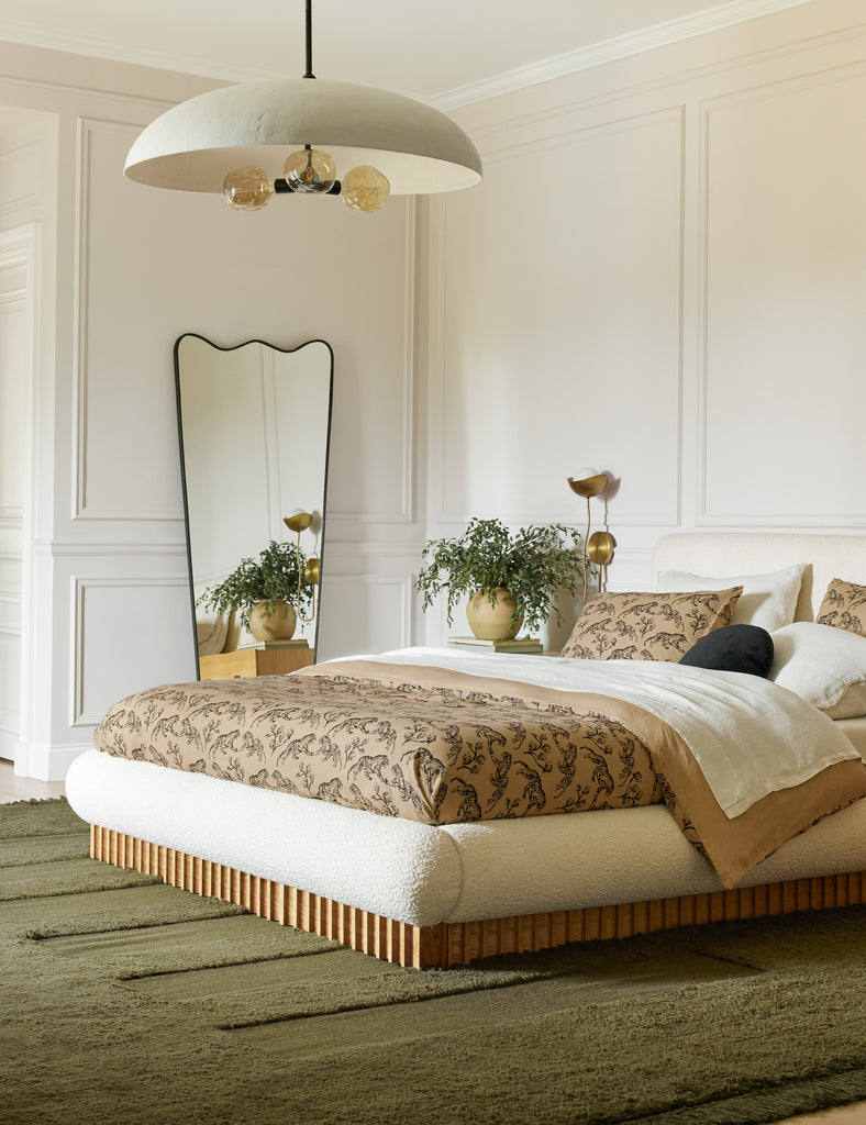 A bedroom is styled with Sarah Sherman Samuel's new collection including the Billow Bed, Raita Rug, Brolly Pendant and Tiger Hemp Duvet and Sham.