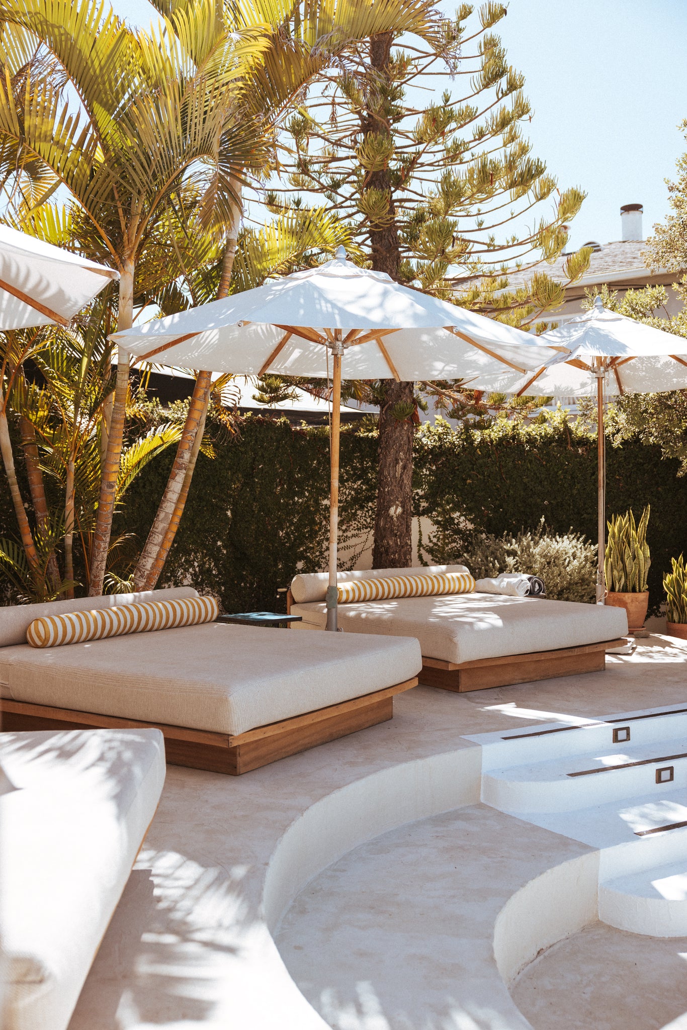 Pool daybeds with the Sarah Sherman Samuel long bolster pillow.