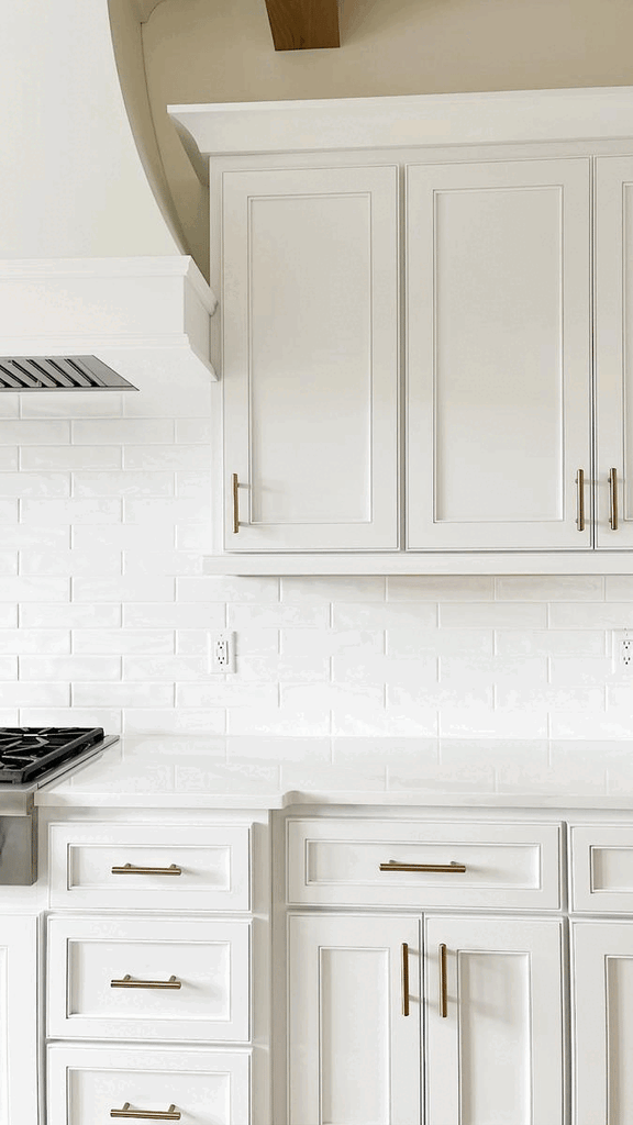 A white kitchen cabinet and drawer open to reveal storage. The drawer has a spice rack with labeled bottles of spices laying down and the cabinet has containers and wire bins full of food.