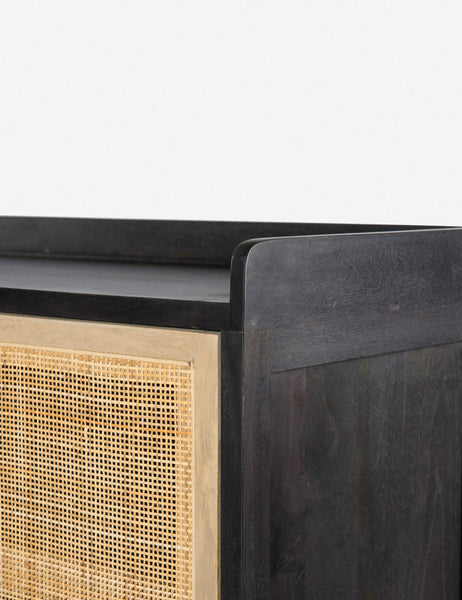 #color::black | Close-up of the walled exterior surface of the Philene black mango wood sideboard with cane doors
