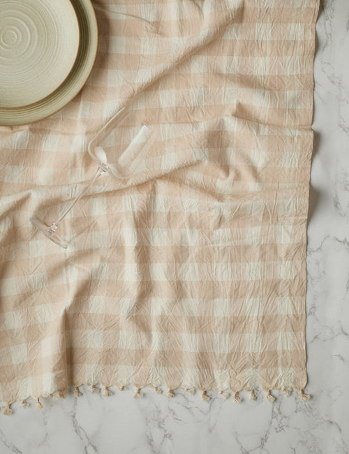 https://cdn.shopify.com/s/files/1/0299/2822/6915/products/Heather_Taylor_Home_Gingham_Tablecloth_Large_-_Cream_13_500x650_crop_center.progressive.jpg?v=1659998396