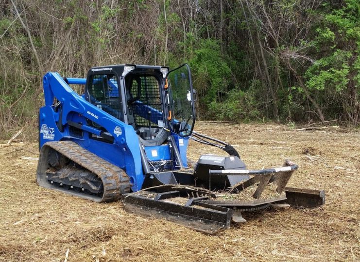 Blue diamond brush cutter on a bobcat