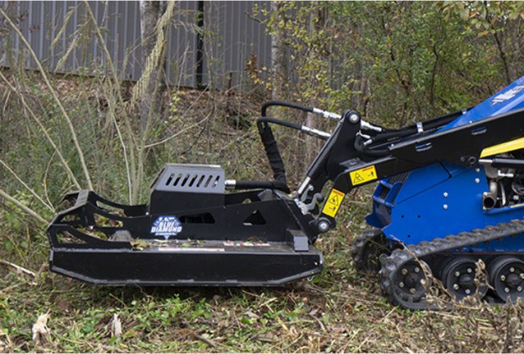 Blue diamond Brush cutter on a mini skid loader