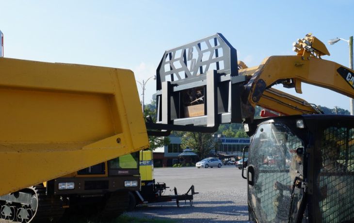 blue diamond pallet forks unloading a dump trailer 