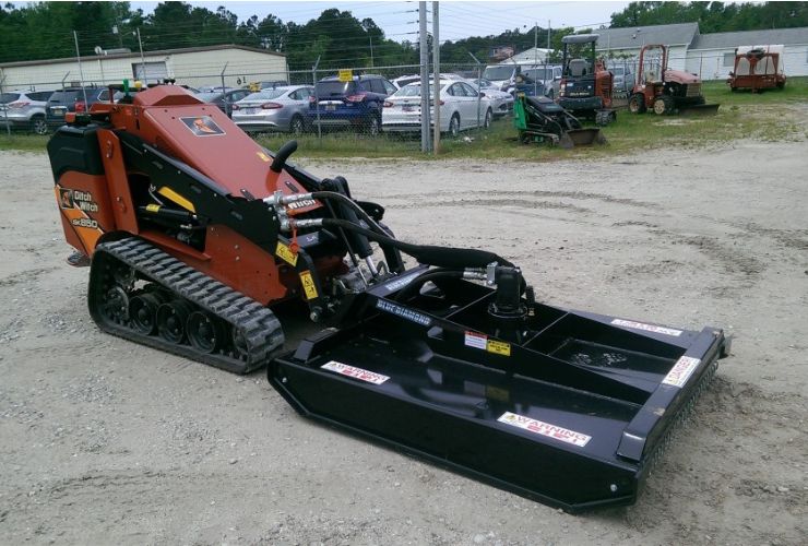 ditch witch with a blue diamond brush cutter