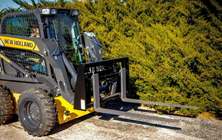 Low profile pallet forks on new Holland skid steer