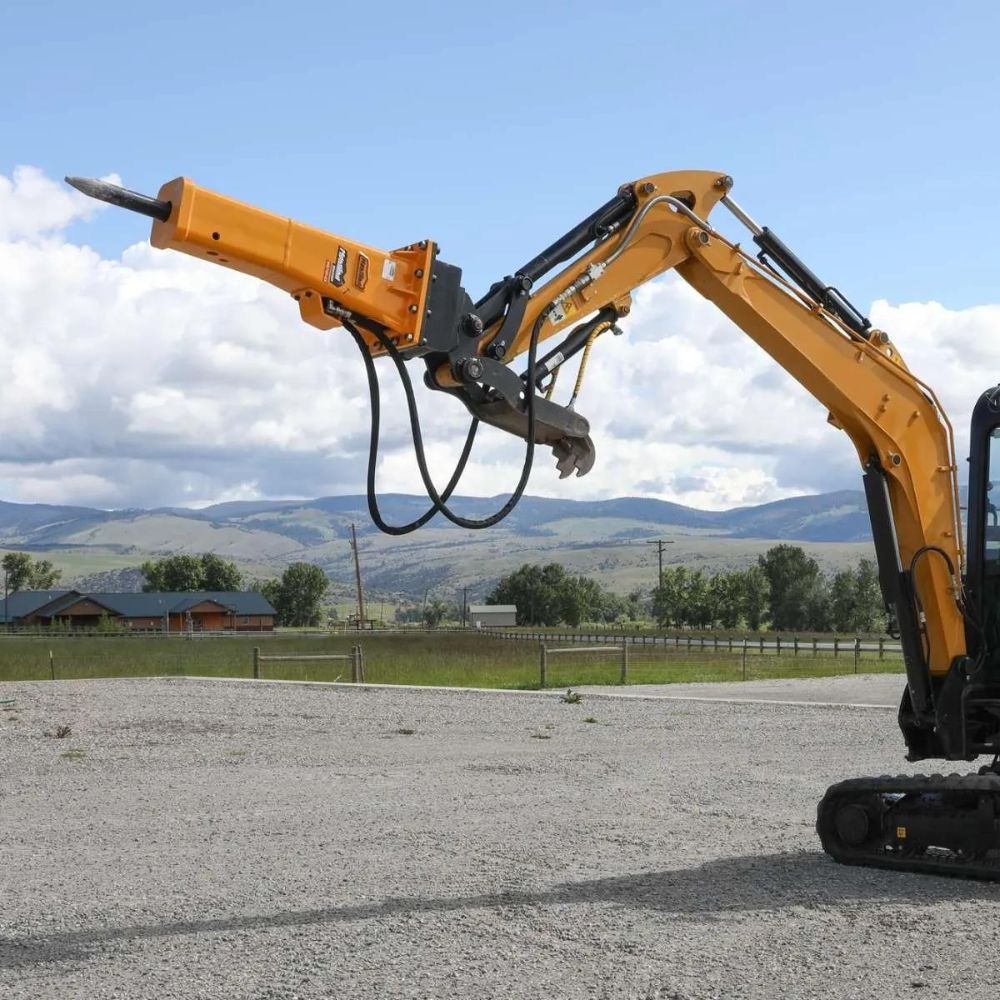 Montana hydraulic breaker attached to excavator side view