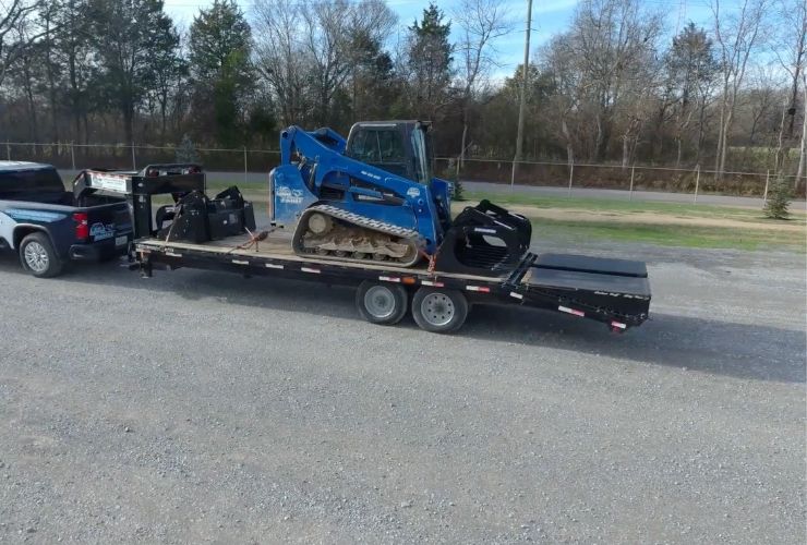 towing a skid steer on a trailer