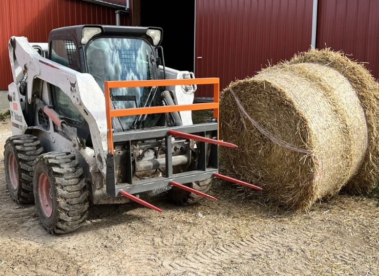 Bobcat with wheels and a bale spear attachment