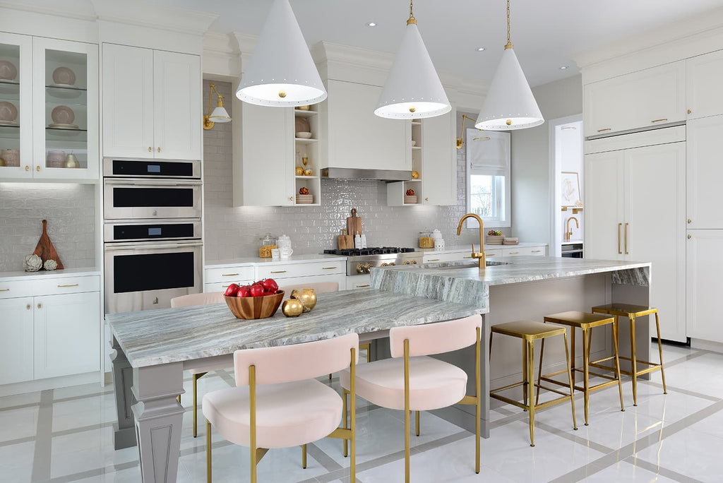 White kitchen with gold and brass accents. Gold champagne cabinet handles and knobs on white kitchen cabients. Mixing metals with different colored fixtures. 