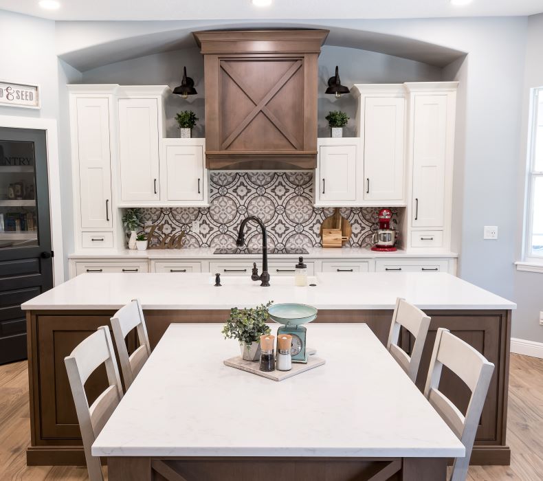 Spanish kitchen with wood cabinets and white cabinets both accented with graphite cabinet knobs and handles.