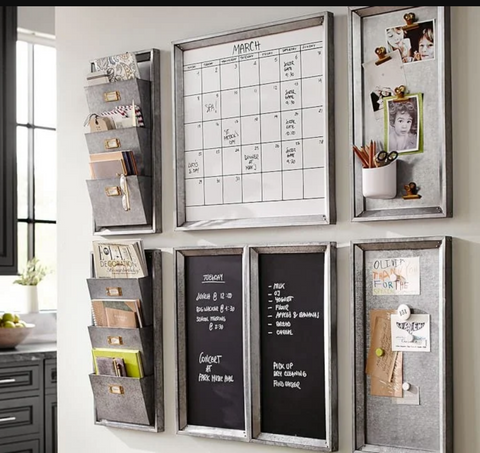 kitchen command center featuring calendars wall chalk boards storage bins and other organizational storage 