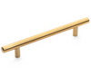 Brushed brass cabinet pull in gold tones. How to pick the right color for your cabinet handles