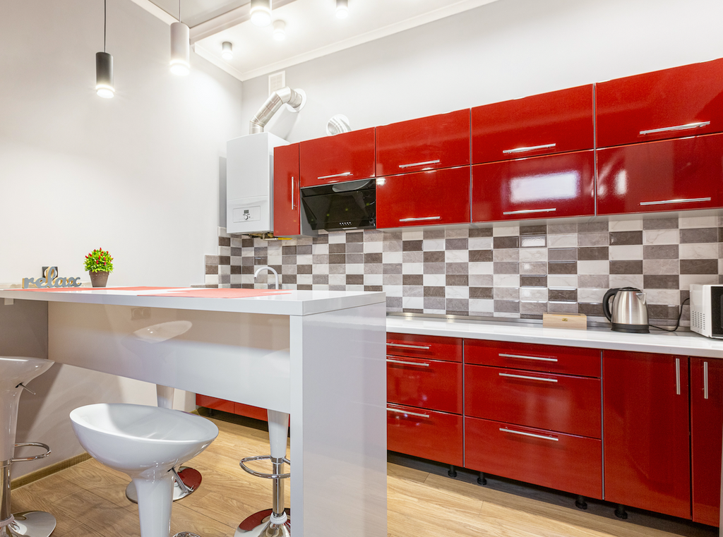 Modern red, white and black kitchen with satin nickel cabinet pulls