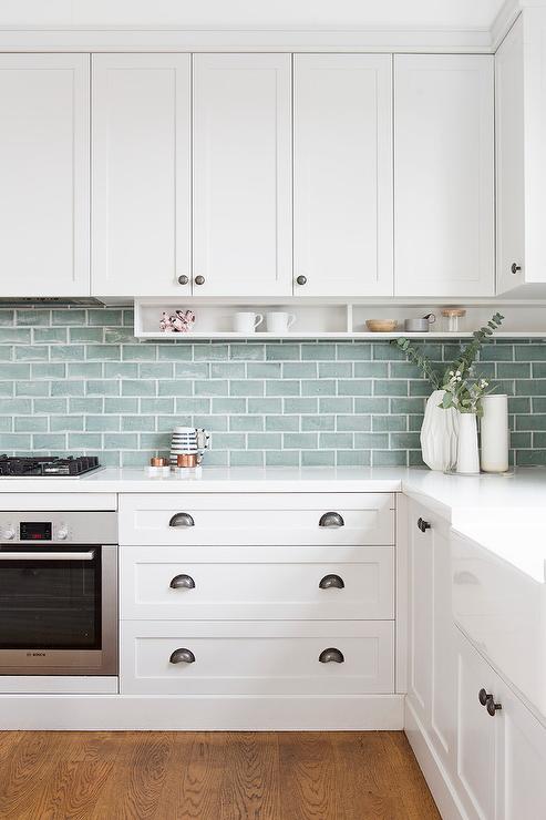 white cabinets in a kitchen with antique silver cup pulls 783AS Cosmas