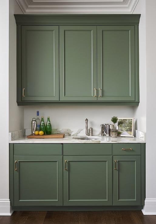 Moss green cabinets in kitchen with stain nickel handles