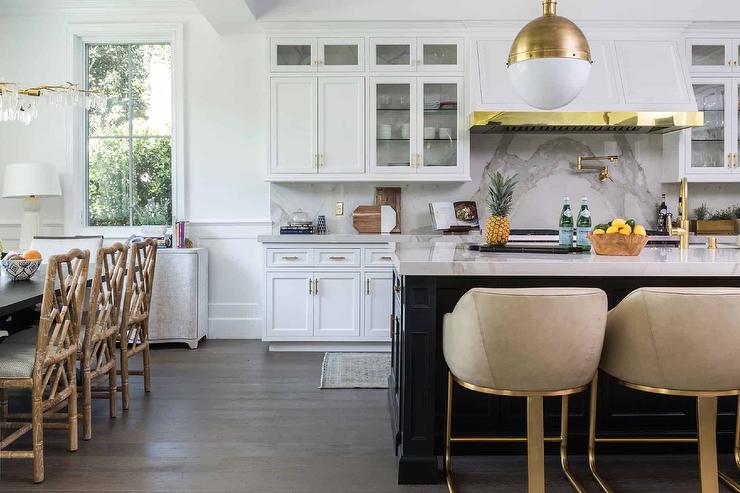 Large kitchen with white cabinets and brushed gold brass cabinet handles on white ktichen cabinets