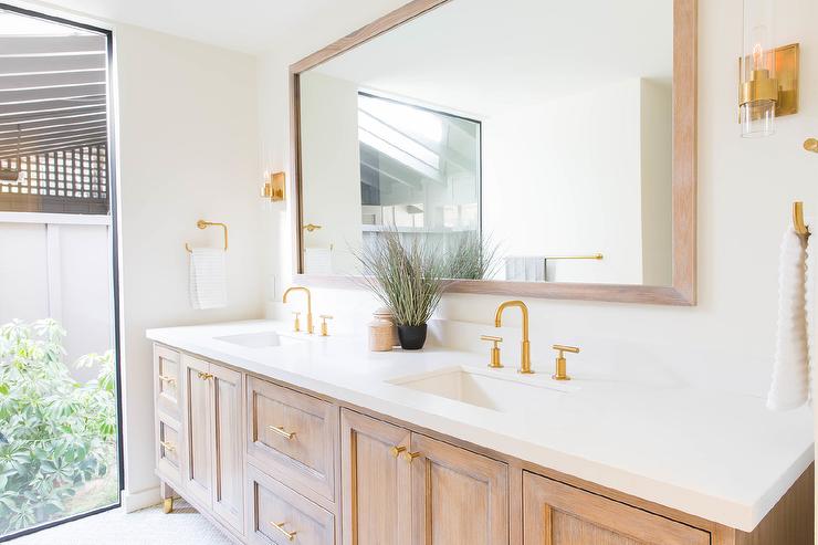 Does the brushed brass knobs and pulls have to match your bathroom faucet and fixtures? 