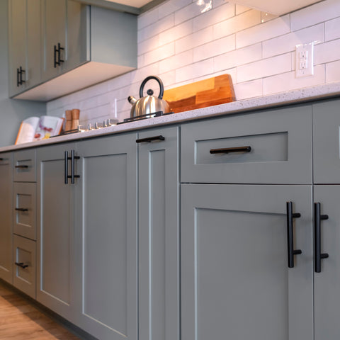 Shaker cabinets in a lush grey with black european bar pulls