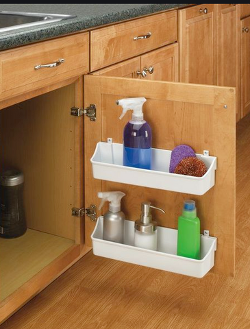 inside a kitchen cabinet door with white storage bins with assorted cleaning products for storage