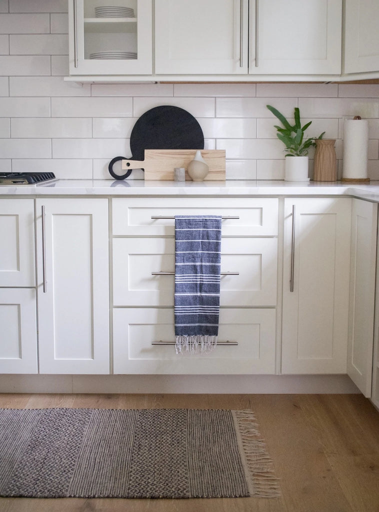 Cabinet handle with drawer pulls on the false drawers