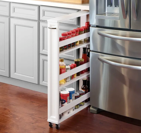 Stainless steel fridge with white sliding pantry rack for additional kitchen storage