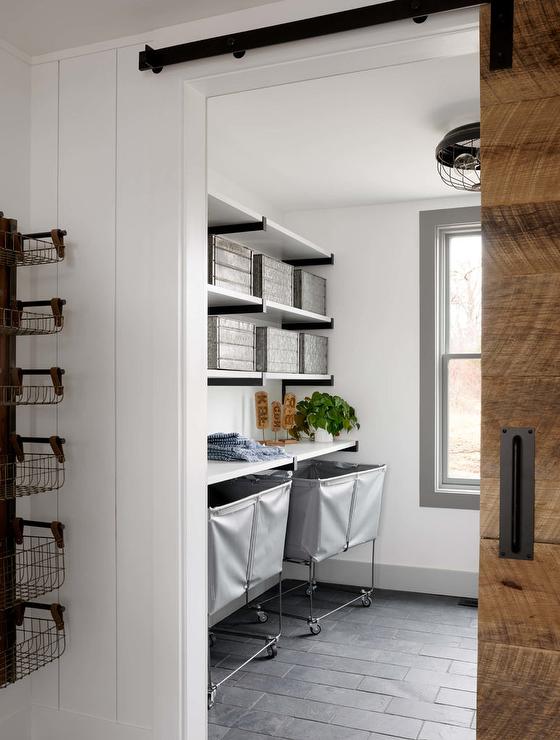 Industrial laundry room with sliding barn door