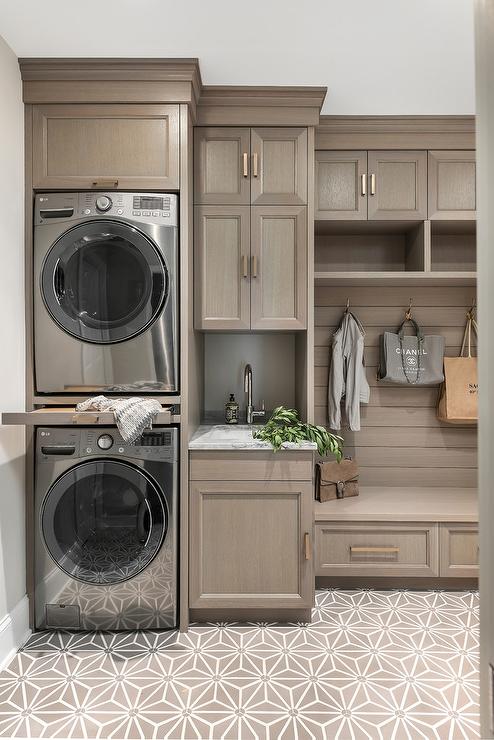 Laundry room with a drop zone and wall hooks for organization