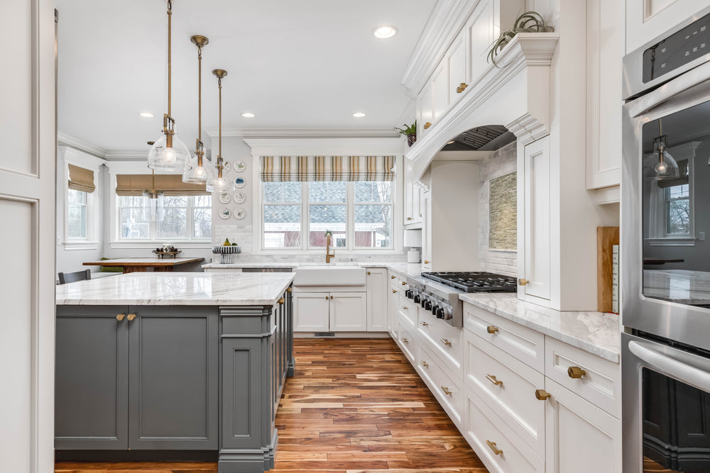 White kitchen with antique brushed brass cabinet knos and pulls. Pulls on your drawers or your doors? 