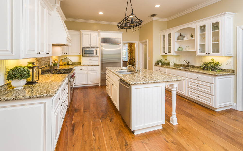 Kitchen cabinet doors with knobs and kitchen drawers with pulls.