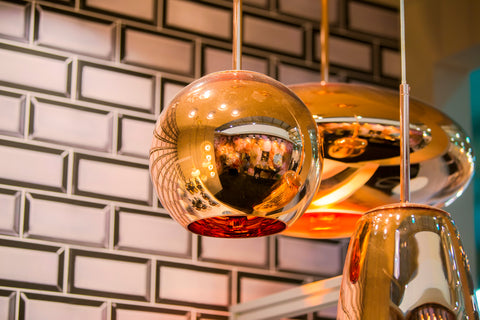 brass copper lights hanging in kitchen